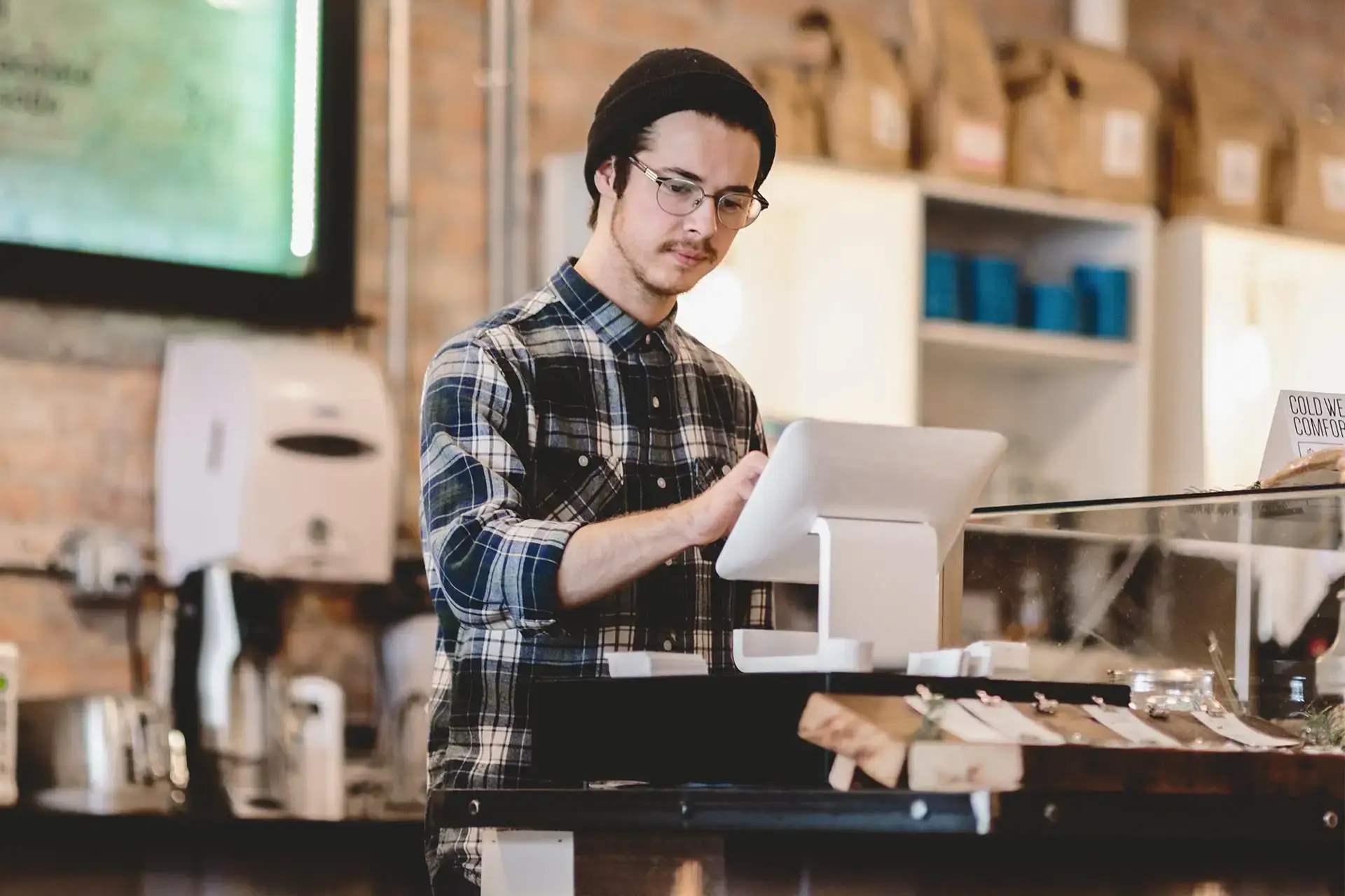 cashier using cash register in cafe 1